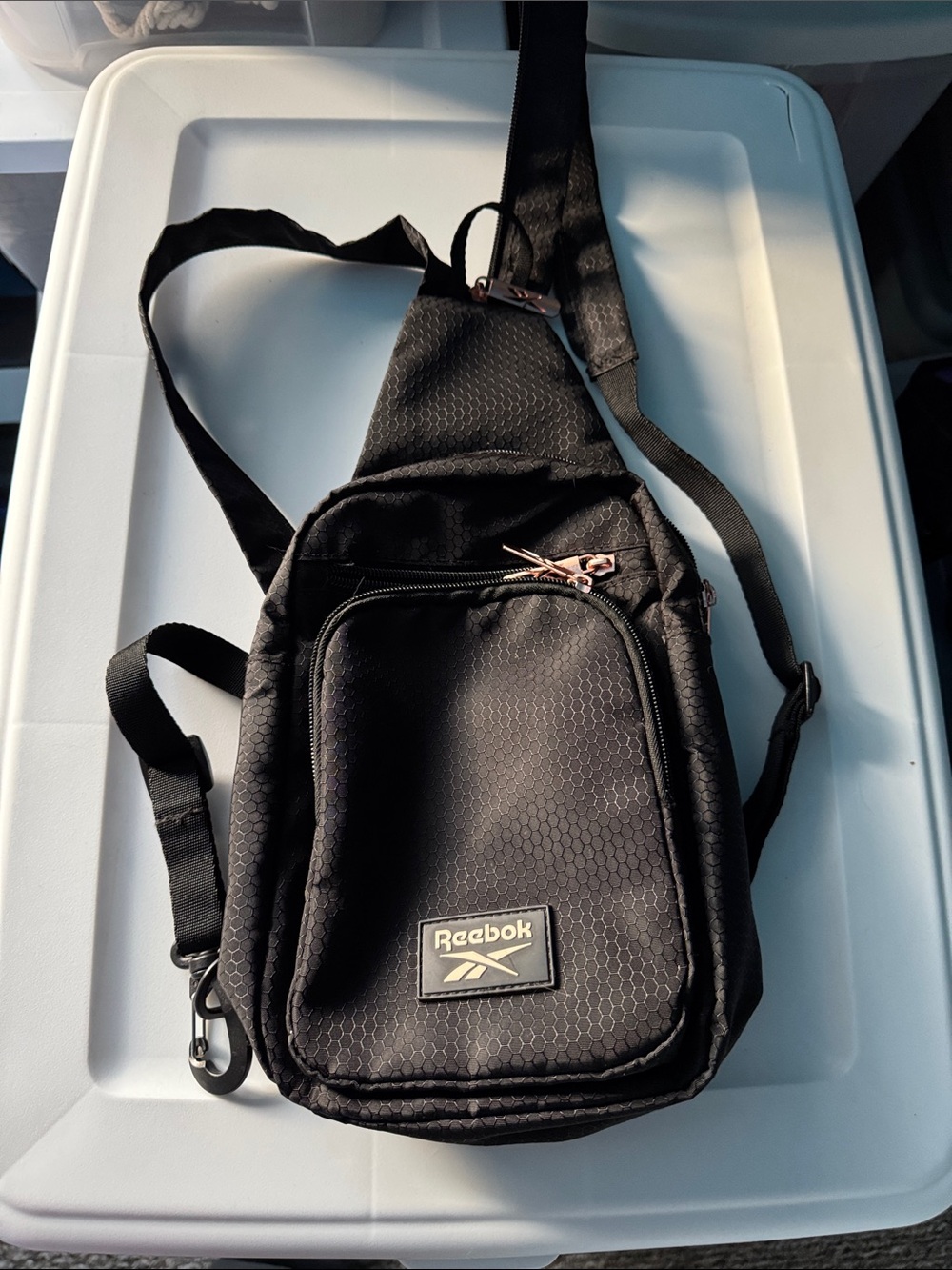 Reebok Black Hex-Pattern Sling Bag with Rose Gold Zippers